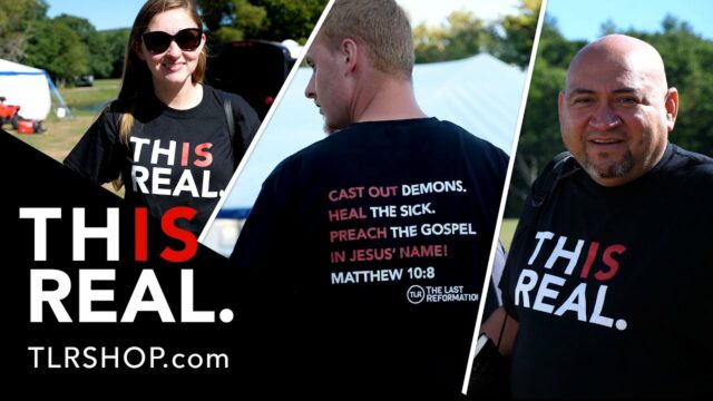 Man and woman wearing the this is real t-shirt